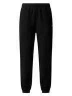 Spodnie sportowe damskie - The North Face Spodnie dresowe Glacier NF0A8DQR Czarny Regular Fit - miniaturka - grafika 1