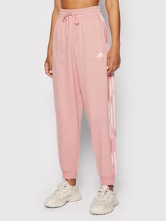 Spodnie sportowe damskie - Adidas Spodnie dresowe Essentials HD9318 Różowy Relaxed Fit - grafika 1