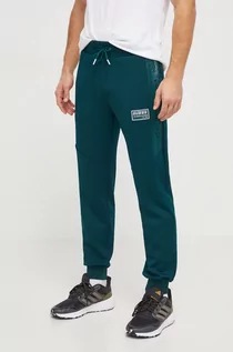 Spodnie męskie - Guess spodnie dresowe kolor zielony z aplikacją - grafika 1