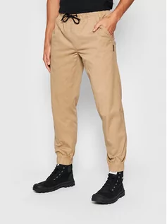 Spodnie damskie - Outhorn Spodnie materiałowe SPMC600 Brązowy Regular Fit - grafika 1