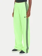 Spodnie sportowe damskie - adidas Spodnie dresowe adicolor Classic Firebird JW1228 Zielony Loose Fit - miniaturka - grafika 1