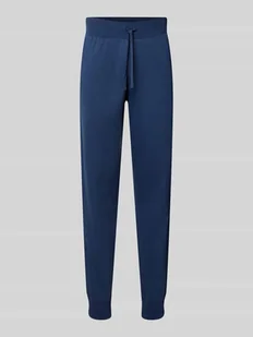 Spodnie dresowe o kroju slim fit z elastycznymi zakończeniami nogawek - Spodnie sportowe męskie - miniaturka - grafika 1