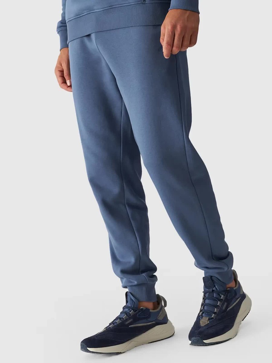 Spodnie dresowe joggery męskie 4F 4FWMM00TTROM0943-32S Granatowy