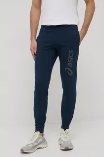 Spodnie męskie - Asics spodnie dresowe męskie kolor granatowy z nadrukiem - grafika 1