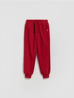 Spodnie i spodenki dla chłopców - Reserved - Bawełniane spodnie jogger - czerwony - miniaturka - grafika 1
