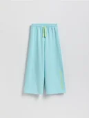 Spodnie i spodenki dla dziewczynek - Reserved - Spodnie dresowe z nadrukiem - jasnoturkusowy - miniaturka - grafika 1