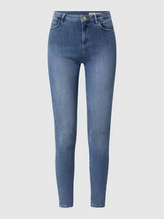 Spodnie damskie - Jeansy o kroju skinny fit z efektami znoszenia - grafika 1
