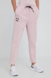 Spodnie damskie - Under Armour spodnie dresowe damskie kolor różowy z nadrukiem - grafika 1