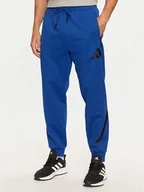 Spodnie sportowe męskie - adidas Spodnie dresowe Z.N.E. JF6541 Niebieski Regular Fit - miniaturka - grafika 1