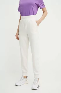 Spodnie damskie - Puma spodnie dresowe kolor beżowy gładkie 847093 - grafika 1