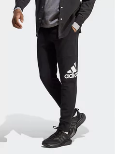 Spodnie sportowe męskie - adidas Spodnie dresowe Essentials French Terry Tapered Cuff Logo Joggers HA4342 Czarny Regular Fit - grafika 1