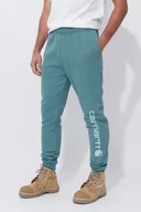 Odzież trekkingowa męska - Spodnie męskie dresowe Carhartt Midweight Graphic Jogger GE1 Sea Pine Heather - miniaturka - grafika 1