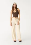 Spodnie damskie - Stradivarius Długie, zwiewne spodnie z teksturą Ecru M - miniaturka - grafika 1