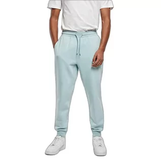 Spodenki męskie - Urban Classics Męskie spodnie do biegania Basic Sweatpants, długie spodnie sportowe, luźny krój, elastyczny ściągacz, dostępne w ponad 10 kolorach, rozmiar S do 5XL, niebieski (Ocean Blue), M - grafika 1