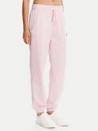 Spodnie sportowe damskie - Under Armour Spodnie dresowe Ua Rival 1382735 Różowy Loose Fit - miniaturka - grafika 1