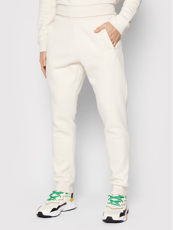Adidas Spodnie dresowe adicolor Essentials HE9410 Beżowy Slim Fit