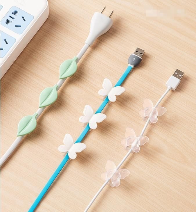 Ozdobny uchwyt na kable w kształcie motylka (9szt.) - przezroczysty