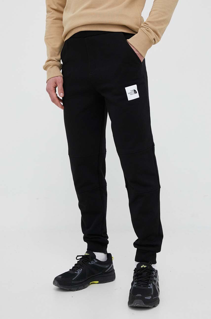 The North Face spodnie dresowe bawełniane kolor czarny z nadrukiem
