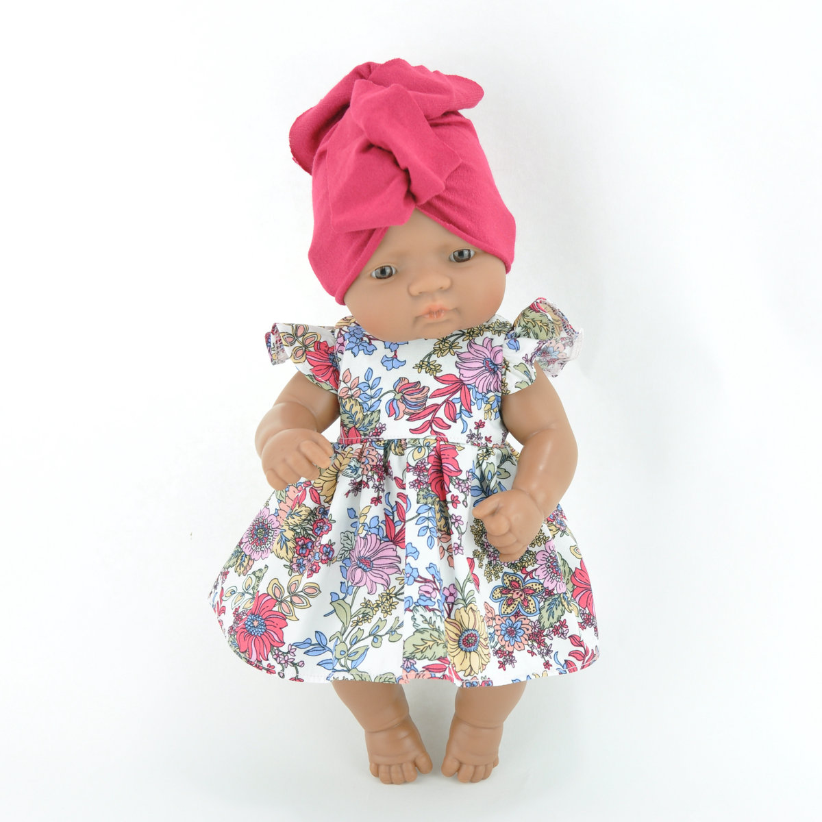 Sukienka w kwiaty i różowy turban dla lalki Miniland 32cm