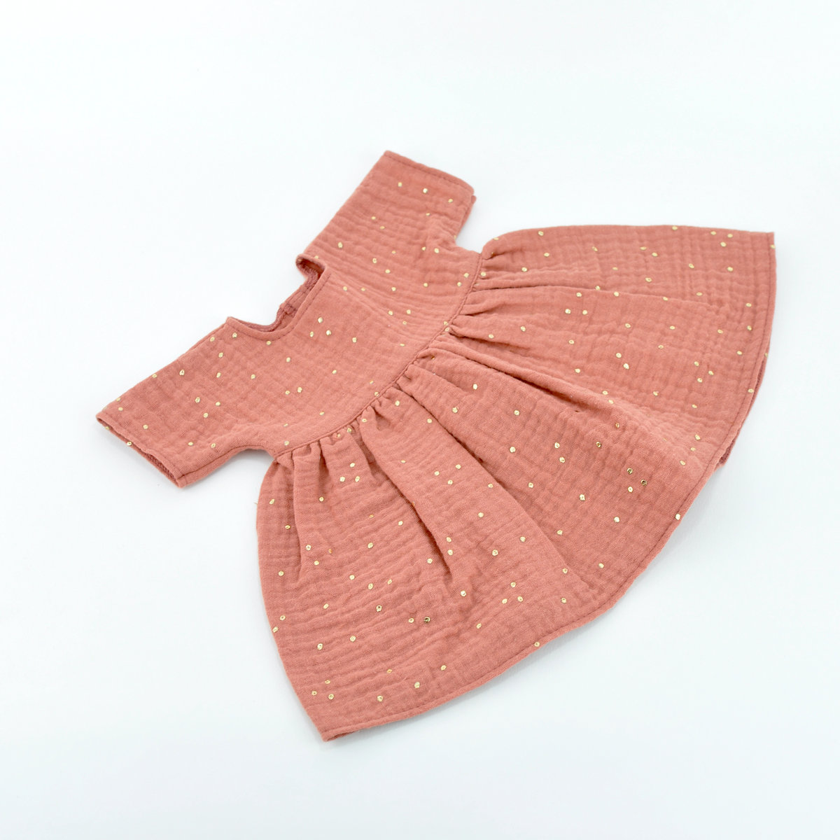 Sukienka muślinowa dla lalki Baby Born 43cm, morelowa w złote kropki