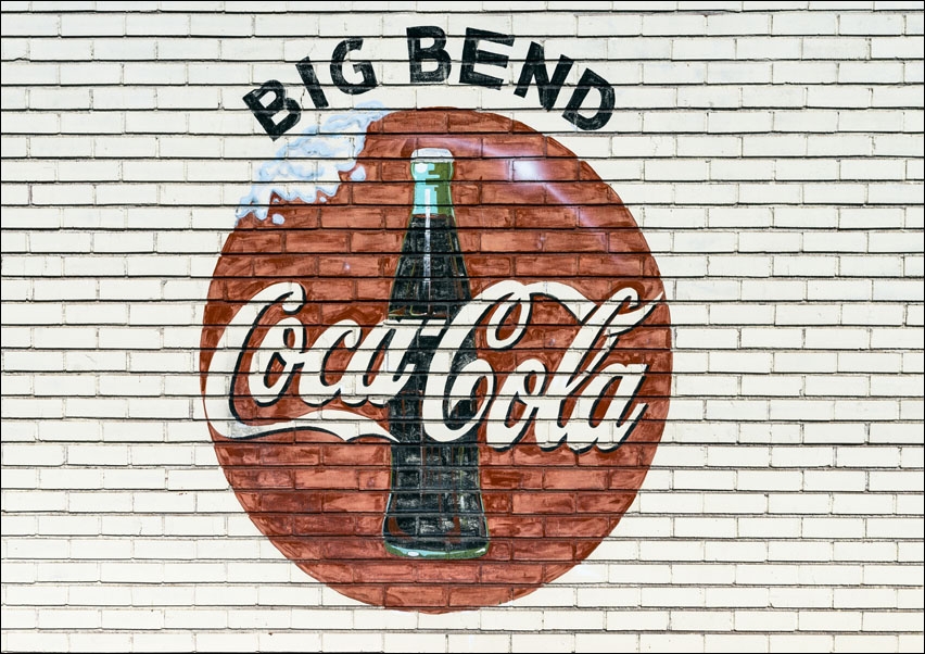 An old company sign appears on the wall of a Coca-Cola bottling plant outside Alpine, Texas., Carol Highsmith - plakat 80x60 cm