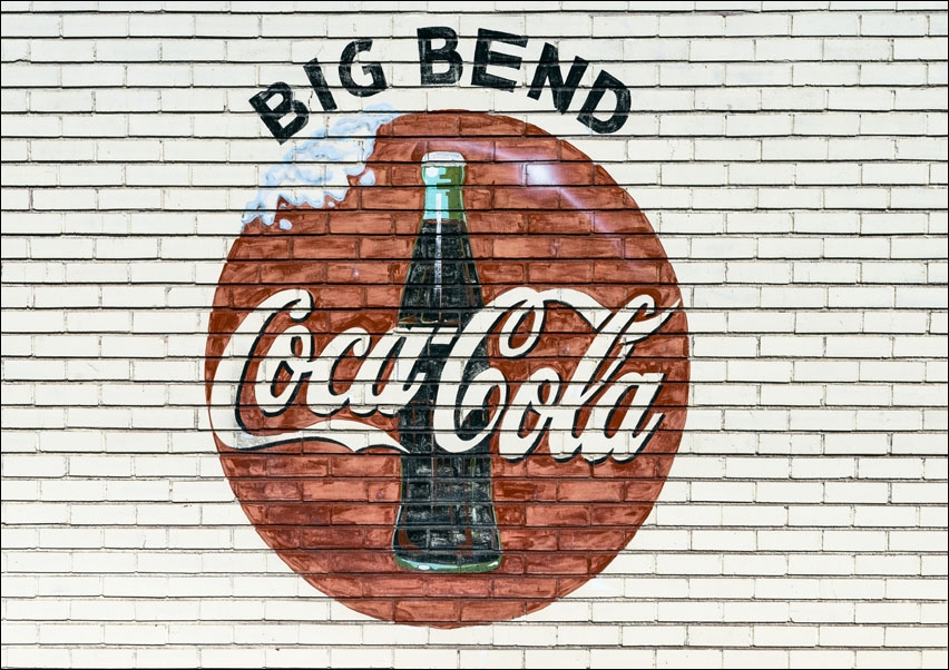 An old company sign appears on the wall of a Coca-Cola bottling plant outside Alpine, Texas., Carol Highsmith - plakat 29,7x21 cm