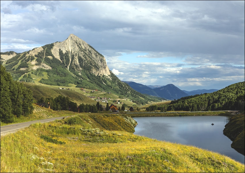 View of Meridian Lake and Mount Crested Butte above the Colorado city of Crested Butte on the high, dirt Washington Gulch Road in Gunnison County, Col