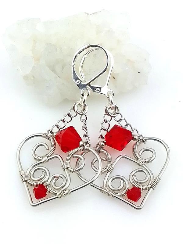 Kolczyki posrebrzane 5.2x2.8 cm, kryształki Swarovskiego, waga obu kolczyków 5.3 grama, znak Raka i Wodnika