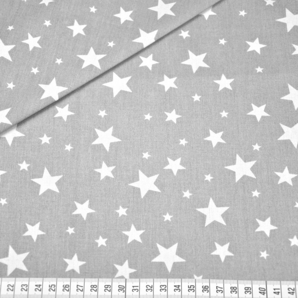 Tkanina bawełniana gwiazdki nowe małe i duże białe na szarym