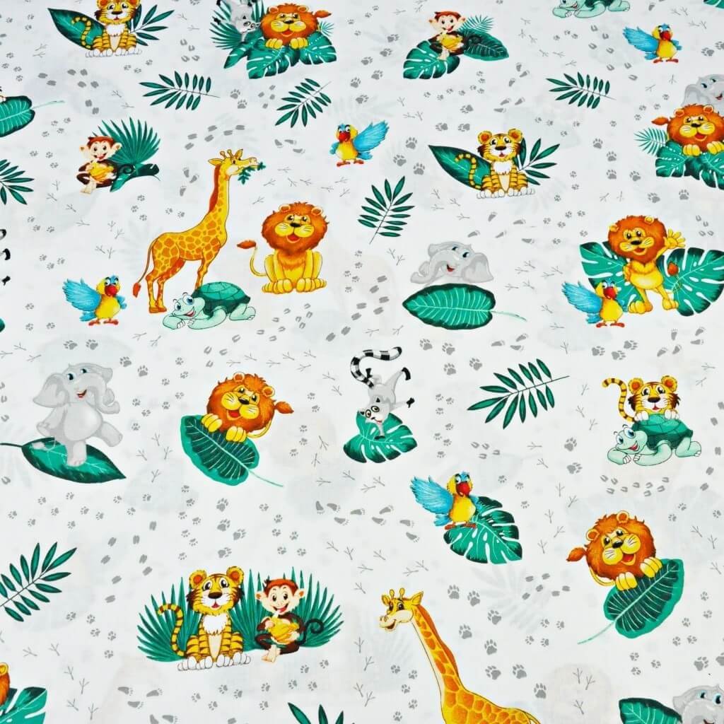 Tkanina bawełniana zwierzątka afrykańskie z szmaragdowymi liśćmi na białym tle - PREMIUM