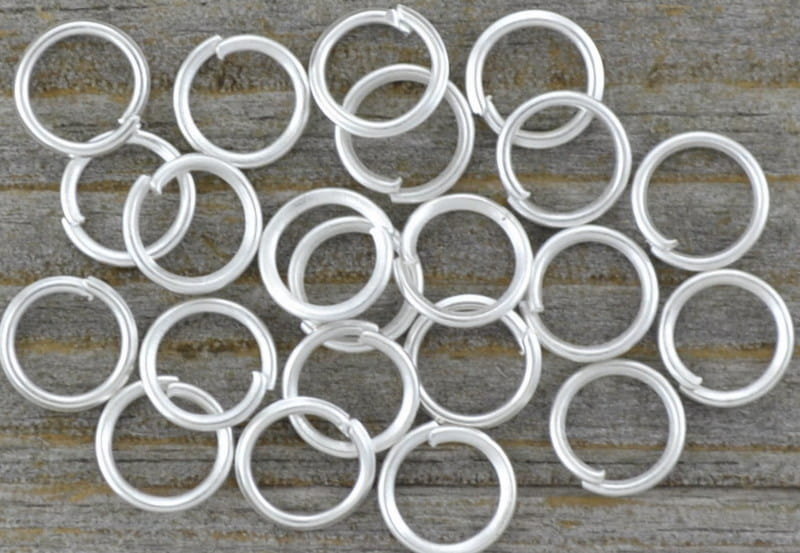 [301008] Ogniwka otwarte 6mm kolor srebra 60szt