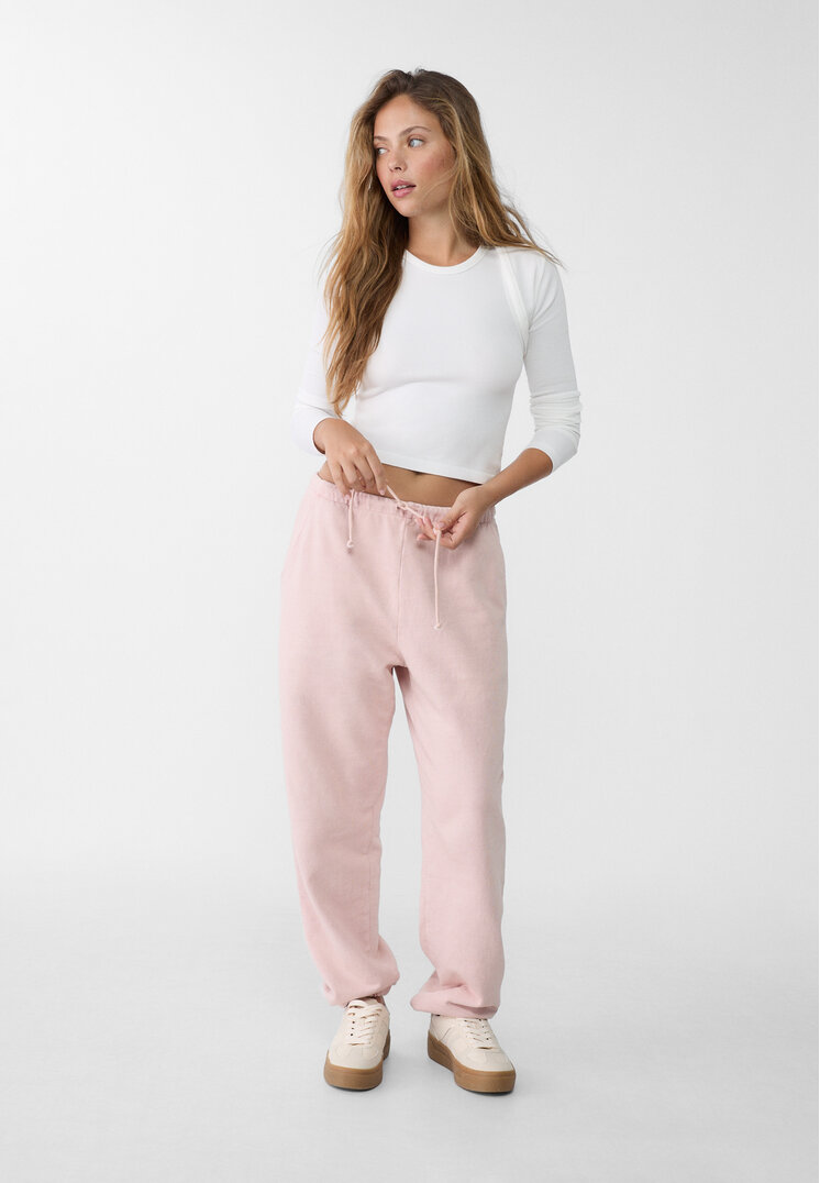 Stradivarius Spodnie jogger boyfriend z efektem sprania  Pudrowy róż M