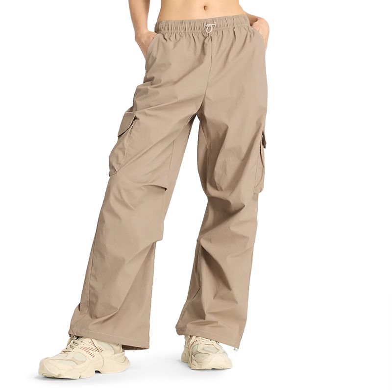 Spodnie New Balance WP43534LMR - beżowe