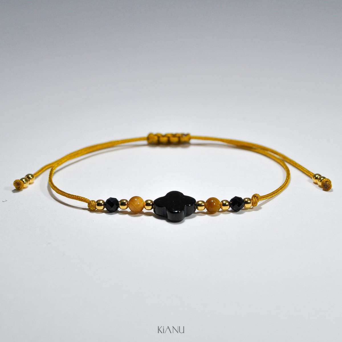 Żółta bransoletka KiANU z onyksu i złotego tygrysiego oka z koniczynką