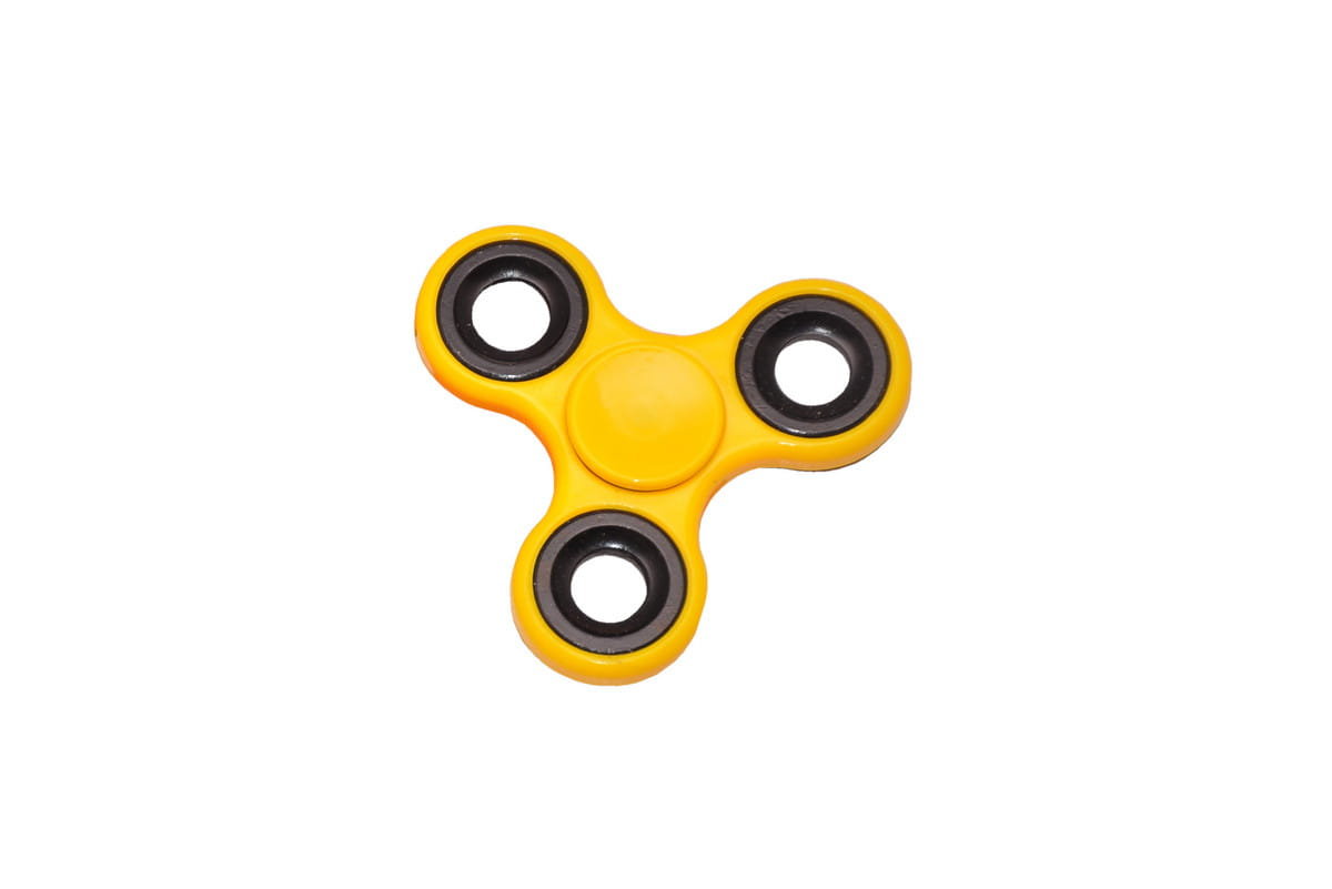 Żółty spinner, fidget spinner.