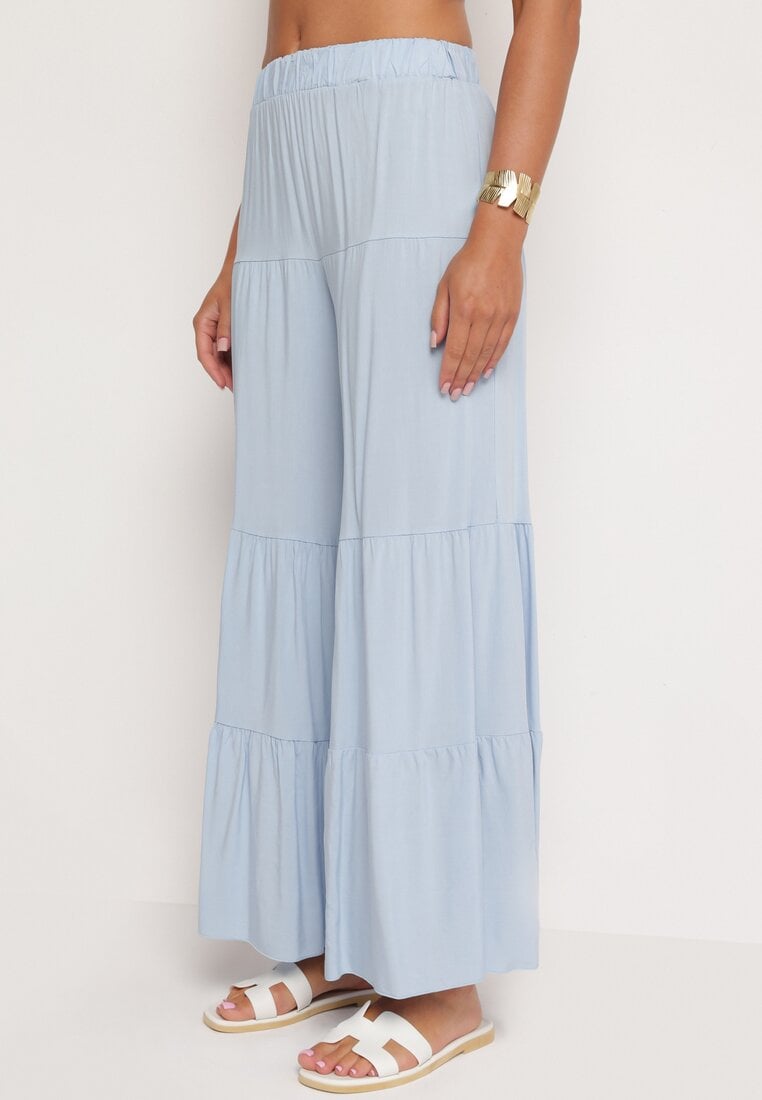 Jasnoniebieskie Szerokie Spodnie z Wiskozy z Gumką w Talii Ozdobione Falbanką Dimlea