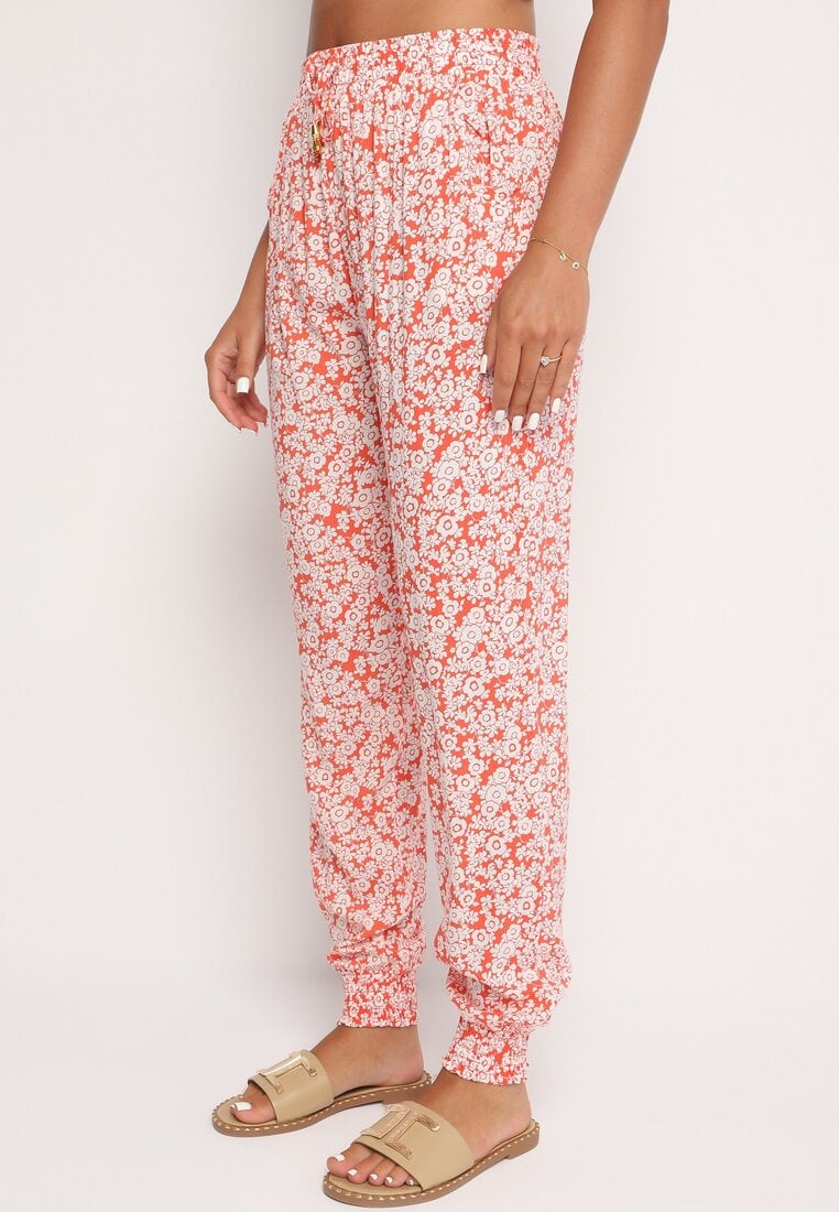 Pomarańczowe Kwiatowe Spodnie z Wiskozy Wykończone Gumką w Talii Rivattha