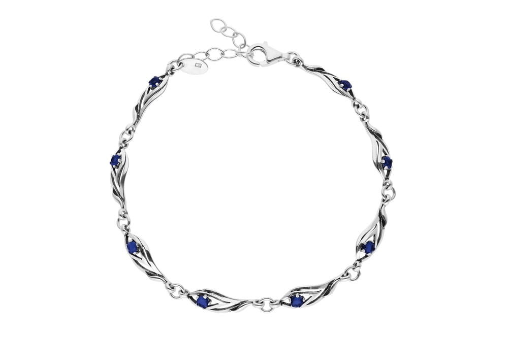 Srebrna bransoletka oksydowana piękny wzór z niebieskimi cyrkoniami pr925