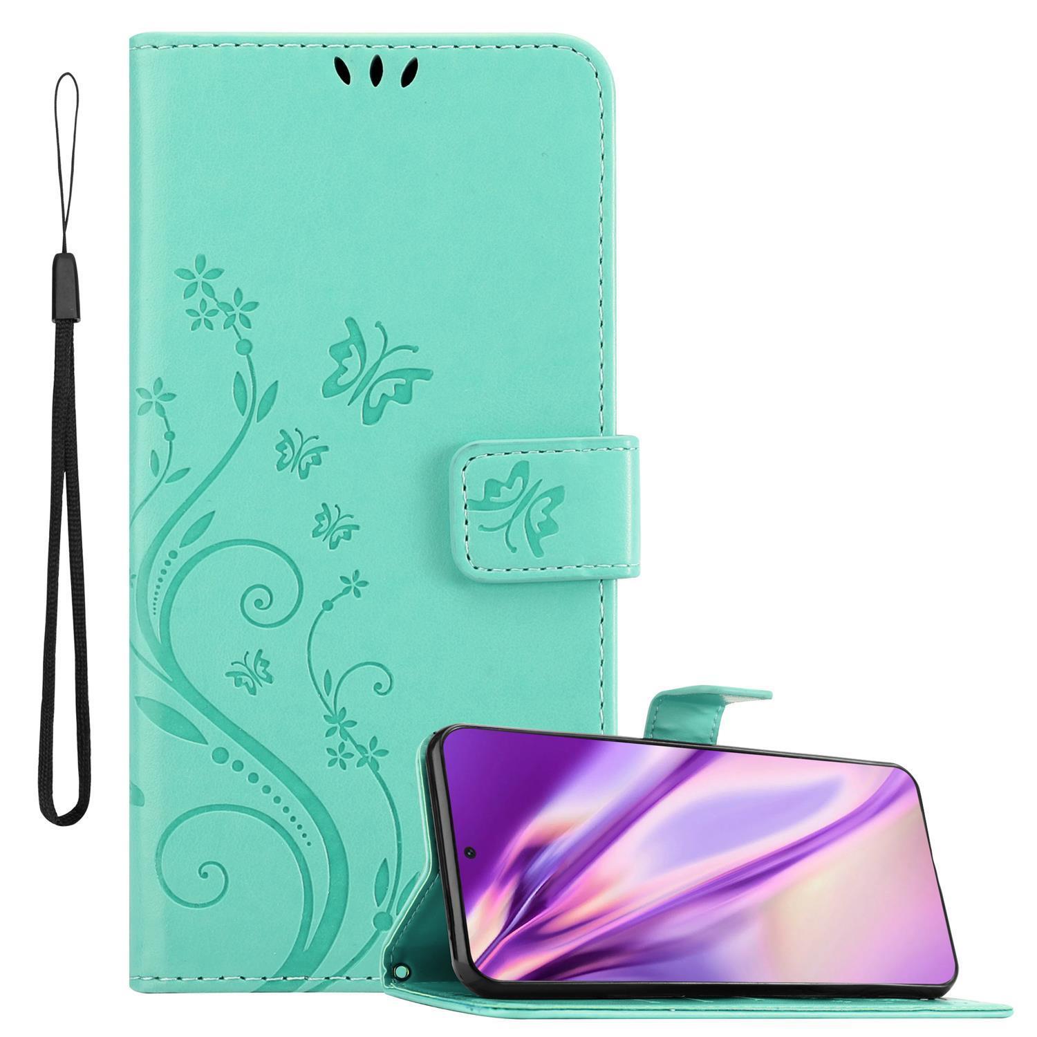 Etui Cadorabo kompatybilne z Samsung Galaxy S21 Ultra w kolorze FLORAL TURQUOISE ? Etui na telefon w kwiatowy wzór z magnetycznym zamknięciem, funkcją podstawki i 3 miejscami na karty? Etui z klapką w stylu książki