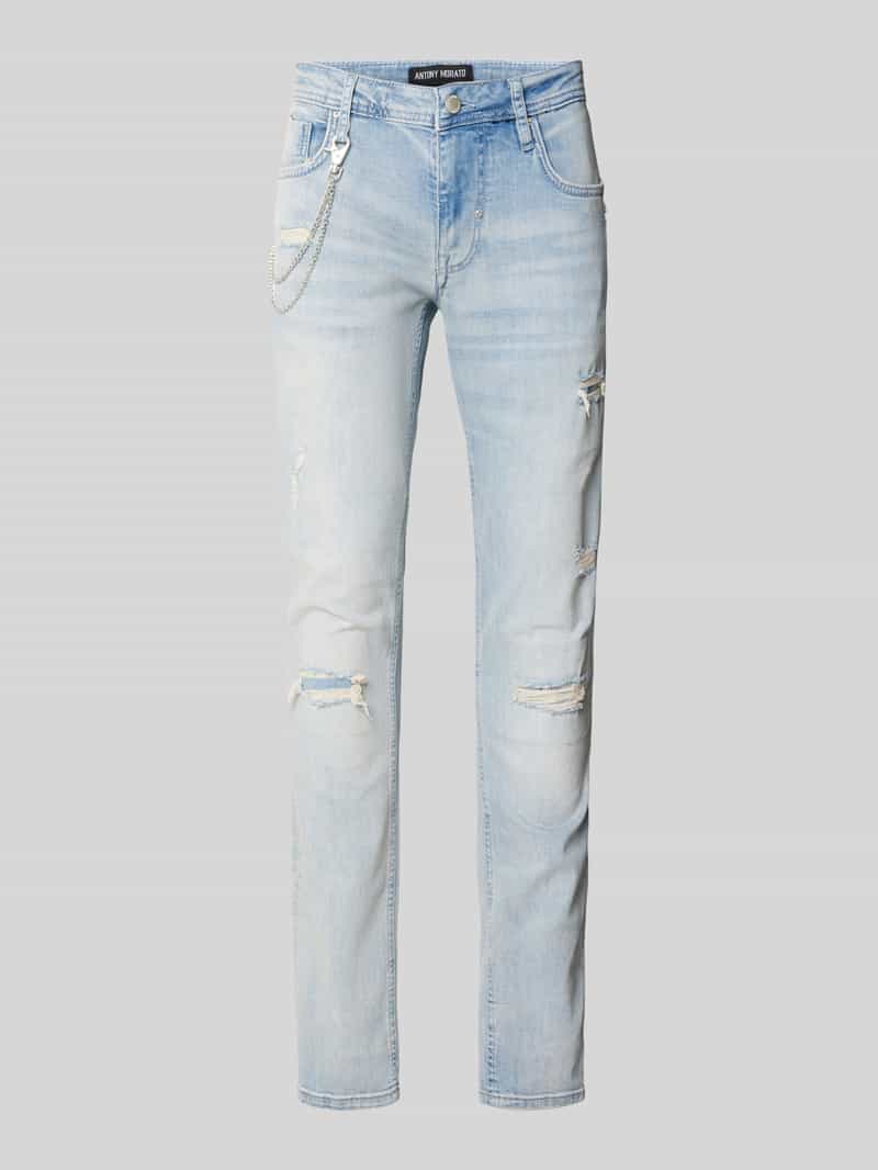 Jeansy o kroju tapered fit z efektem znoszenia