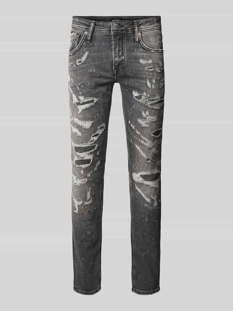 Jeansy o kroju tapered fit z efektem znoszenia