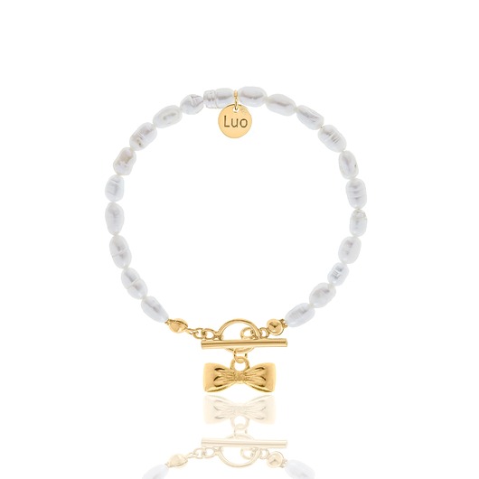 Bransoletka z naturalnych pereł z ozdobnym zapięciem i małą kokardką