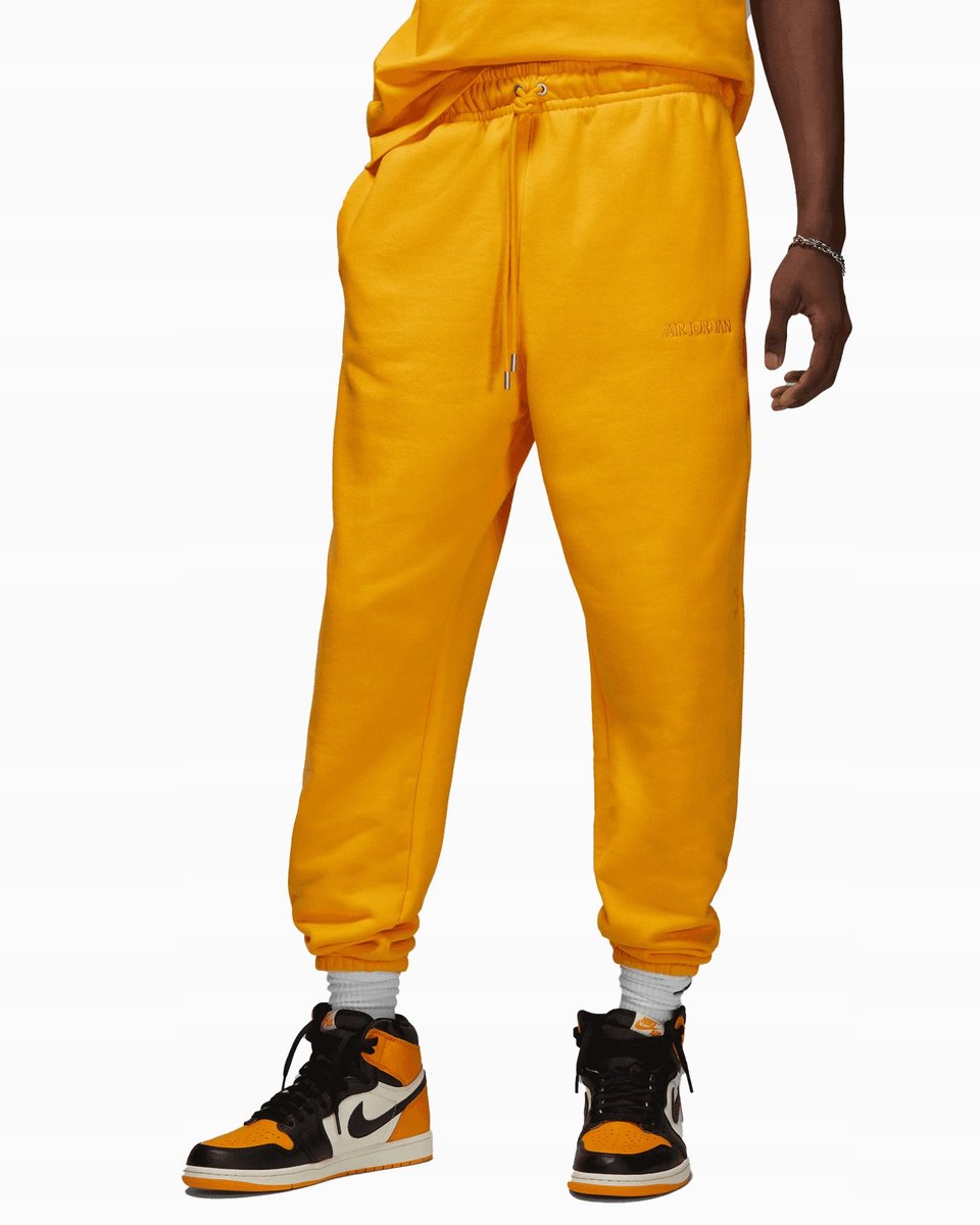 Spodnie dresowe Nike Air Jordan Wordmark Fleece żółte FJ0696-739 r. L