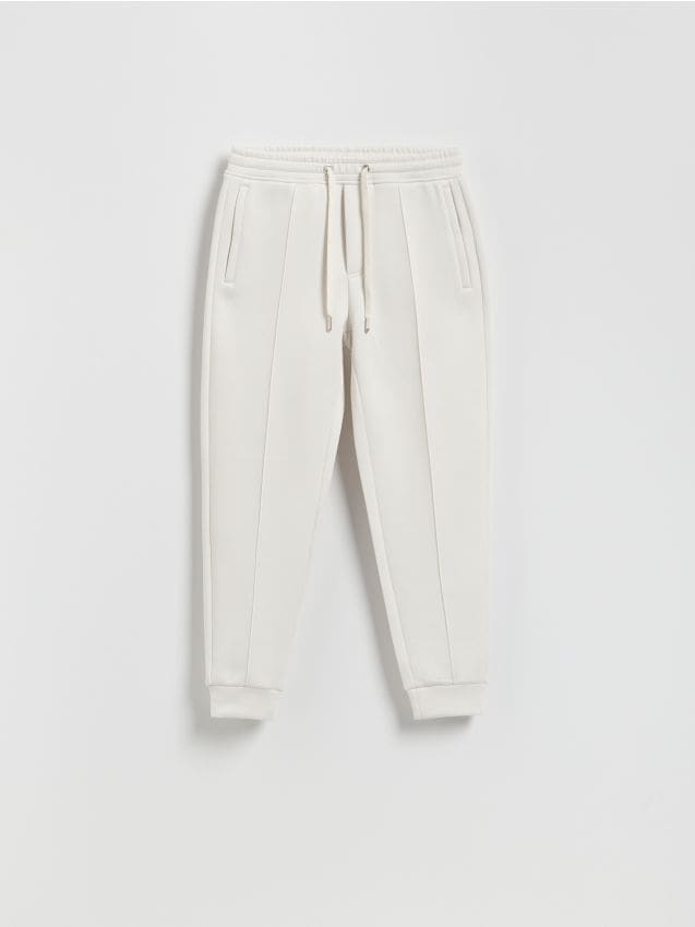 Reserved - Spodnie dresowe slim fit - złamana biel