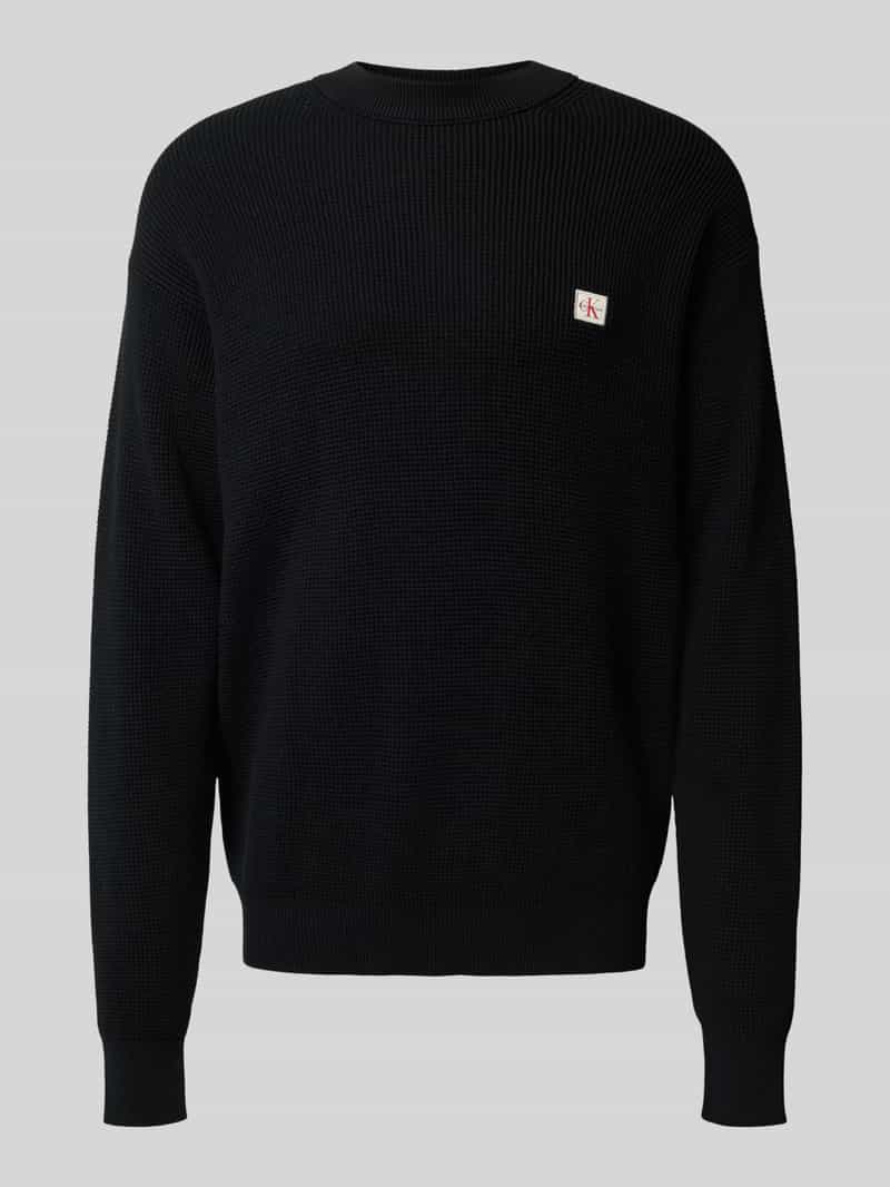 Sweter z dzianiny z naszywką z logo