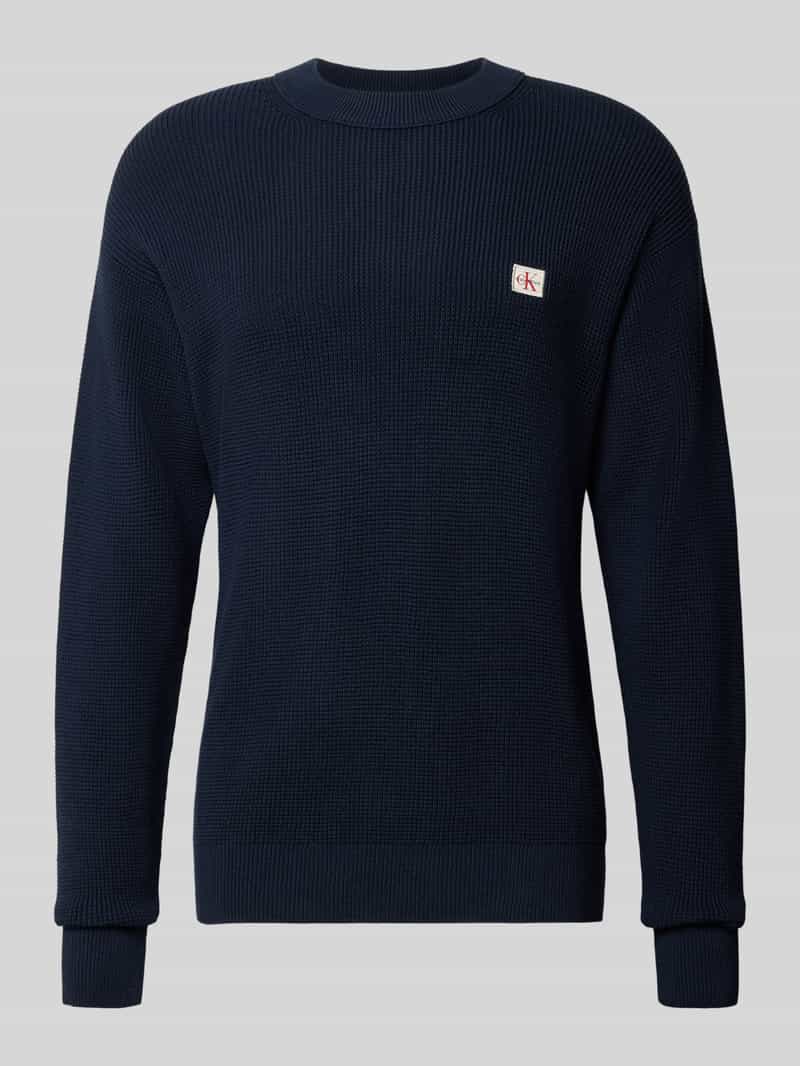 Sweter z dzianiny z naszywką z logo