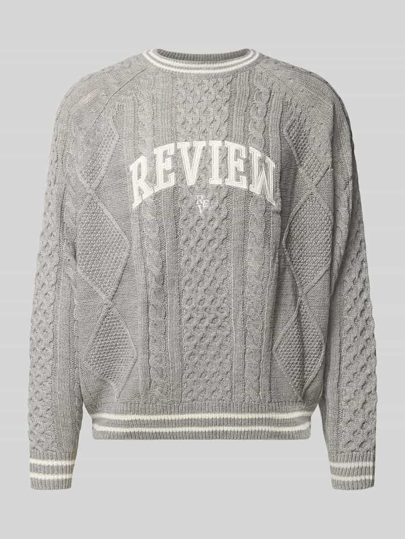 Sweter z dzianiny z wyhaftowanym logo