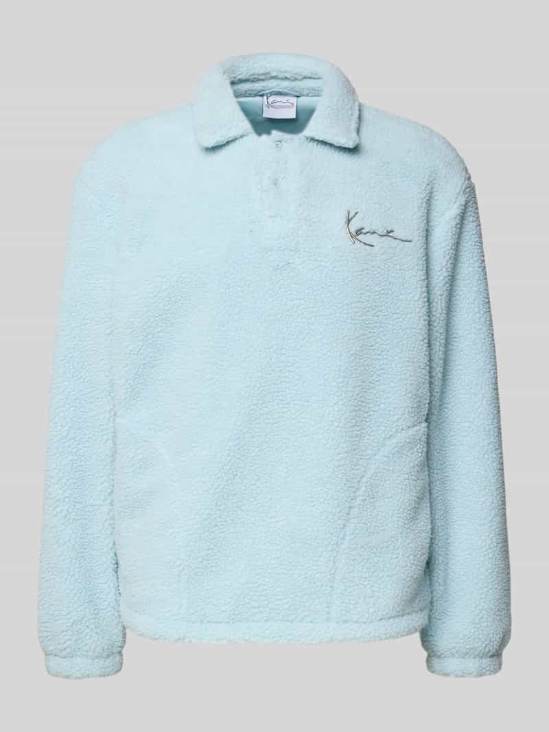 Sweter polarowy z wykładanym kołnierzem i listwą guzikową