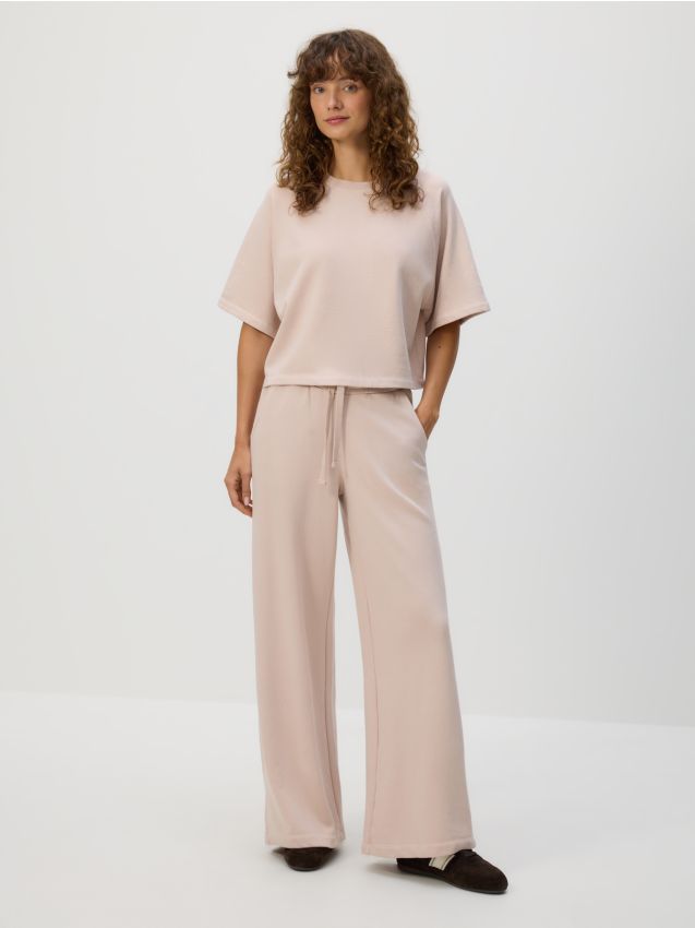 Reserved - Bawełniane spodnie dresowe - pastelowy róż