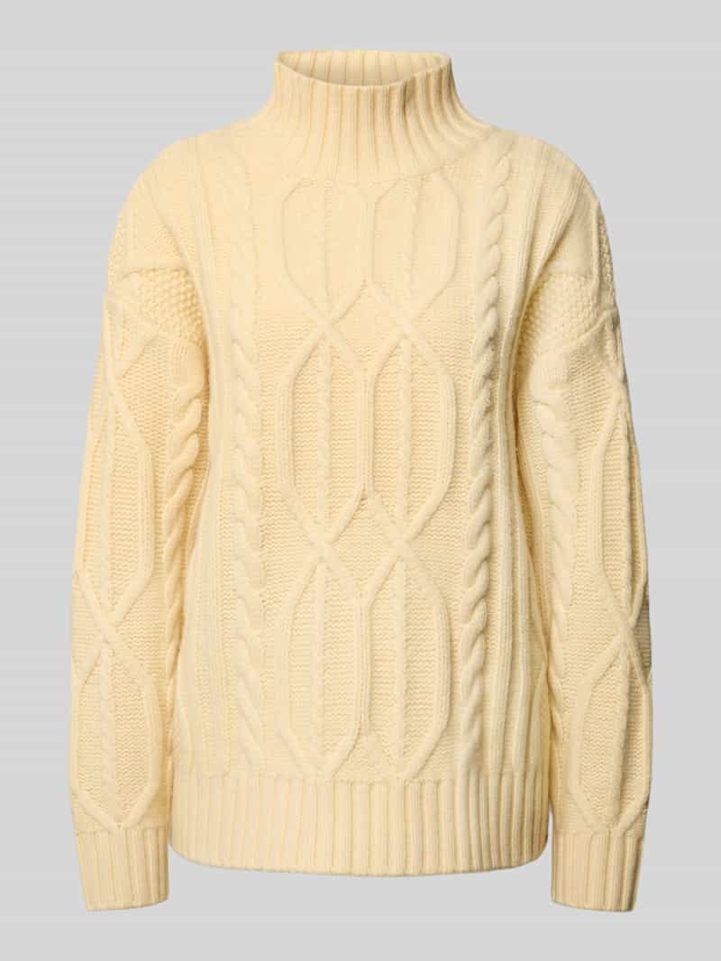 Sweter wełniany o kroju oversized ze ściegiem warkoczowym i prążkowaną stójką